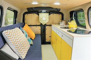 A side-facing settee sits opposite the kitchenette (photo courtesy of Love Campers) A side-facing settee sits opposite the kitchenette (photo courtesy of Love Campers)