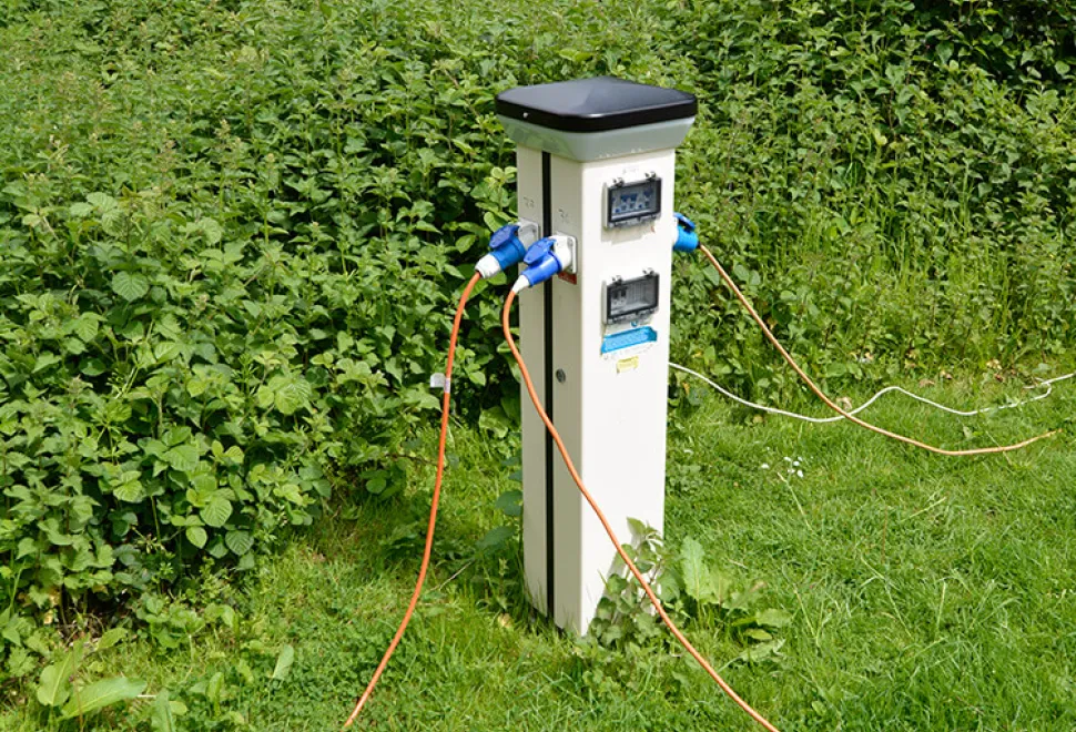 Motorhome hook up bollard on a campsite