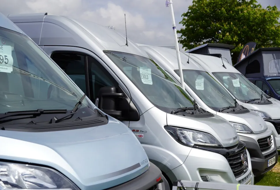 Motorhomes parked in a line at a motorhome show
