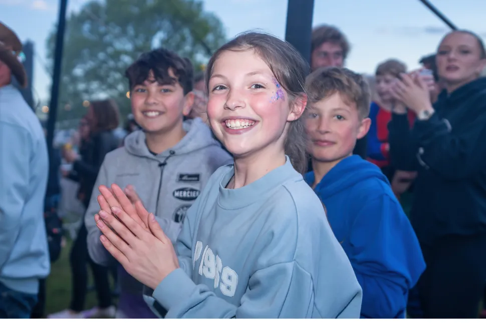 Youngsters enjoying the main stage live music at Campervan Campout Festival