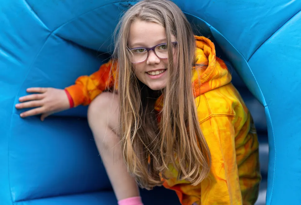 Enjoying the inflatable obstacle course at Campervan Campout Festival 