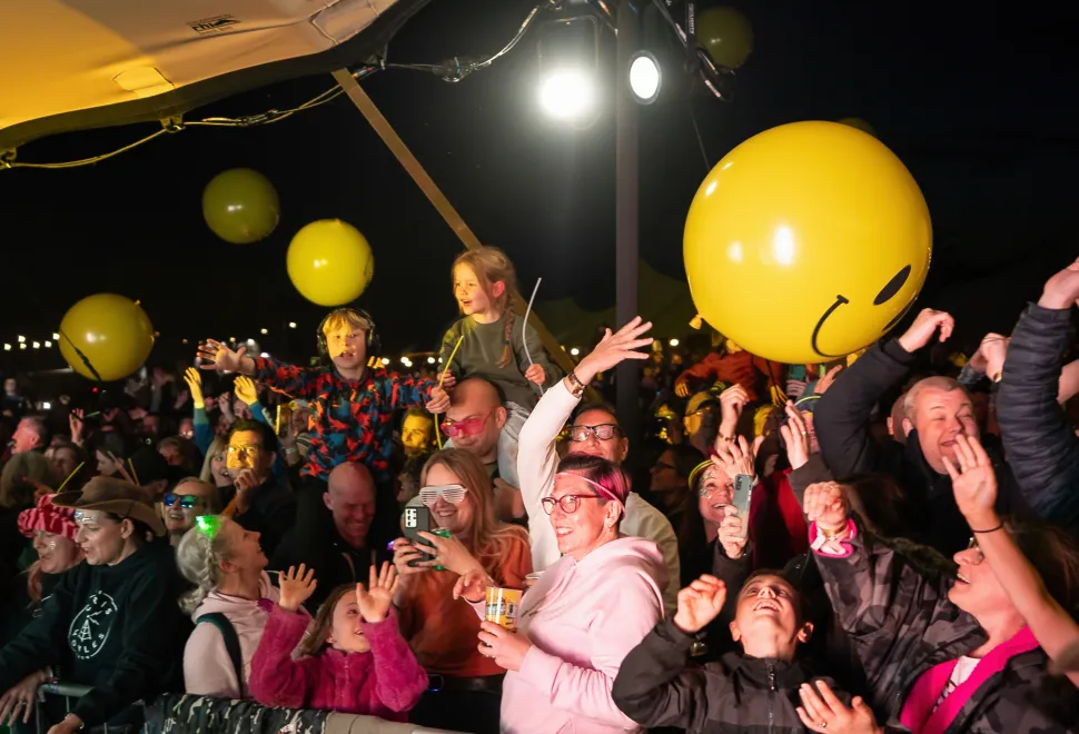 Festival goers enjoying the live evening entertainment at Campervan Campout Festival