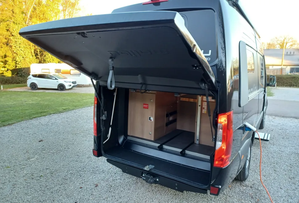 Redesigned rear with top-hinged garage door