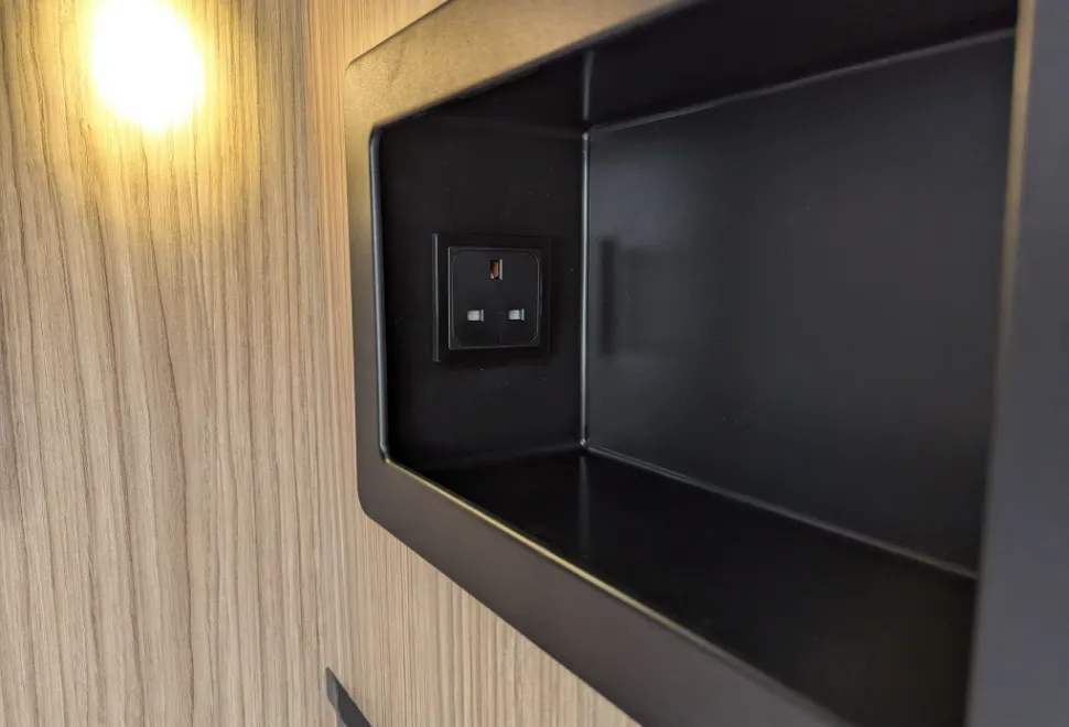 One of the recessed shelves next to the island bed - this one has a three-pin mains socket, but the other one has USB-A and USB-C