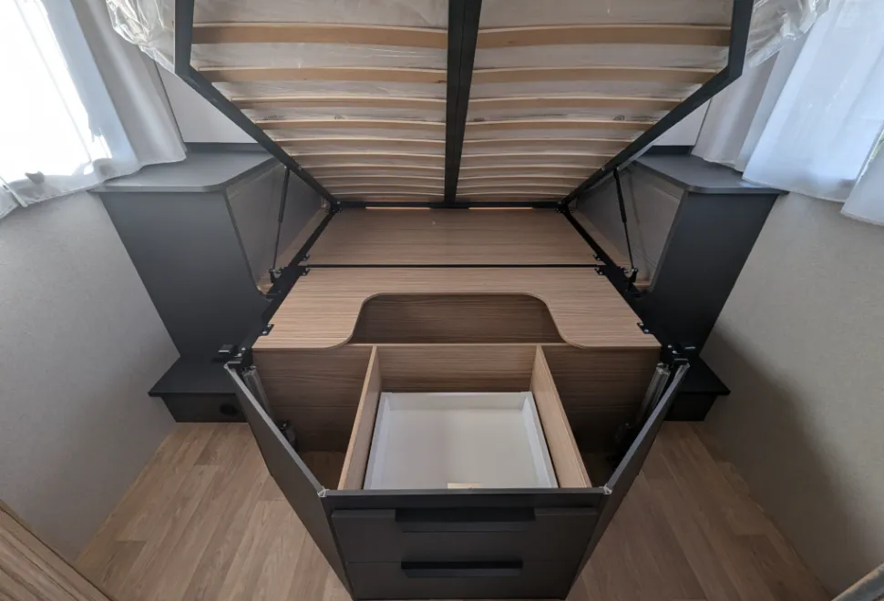 Storage under the island bed is good and the bed lifts up and stays up for access