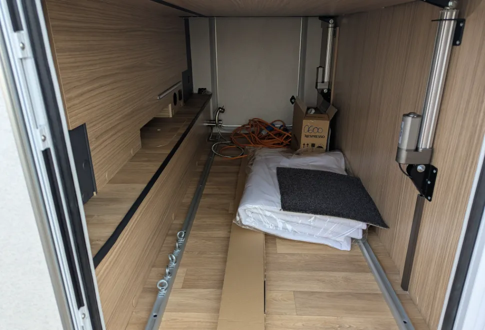 The garage is a useful space with a light, tie down points and a shower at the far end