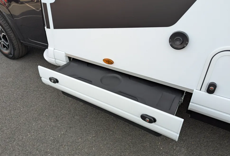 An unexpected skirt locker for mucky campsite items, like levelling ramps