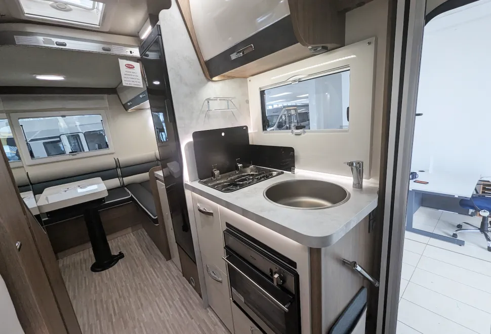 Elnagh Baron 530 interior showing kitchen area by the habitation door