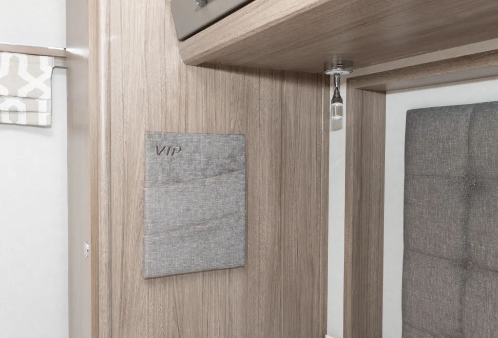 Fabric pockets that are ideal for phones are on each side of the bed 