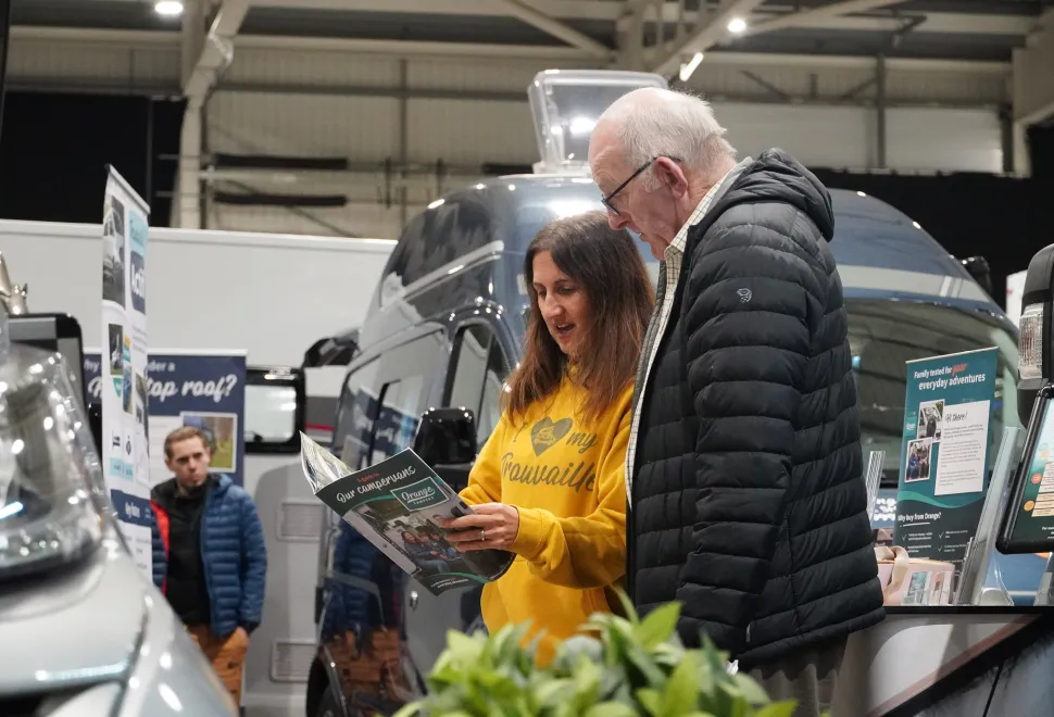 Browsing a brochure at the Jan Sale
