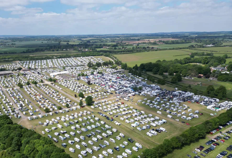 The Newbury showground full of happy campers in the sunshine