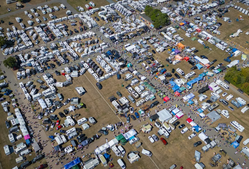 A birds eye view of a busy trade area in the sunshine.