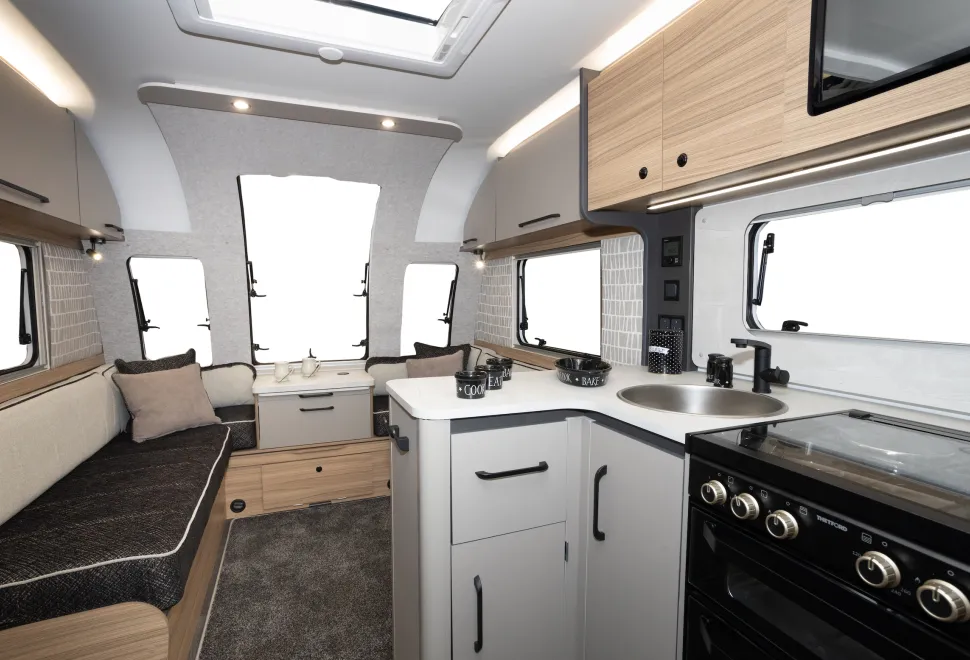 The L-shape of the kitchen creates a large amount of surface space