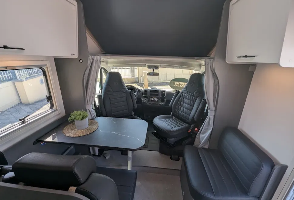 Etrusco A 6.9 SB 2026 motorhome showing overcab bed base raised and cab seats swivelled