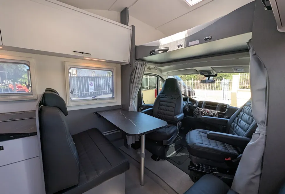 Etrusco A 6.9 SB 2026 motorhome showing lounge and overcab bed base lowered
