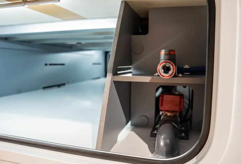 Water filling (with Hozelock-style attachment) and emptying point in double floor access by side locker door: Frankia Noctra Cruiser 7.6L