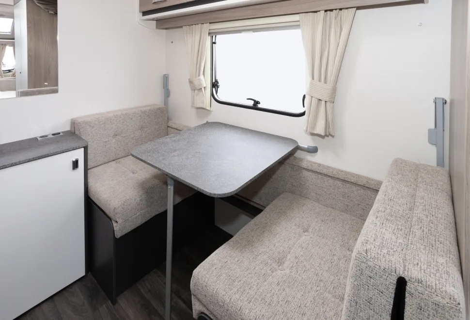 A seating area that transforms into bunks