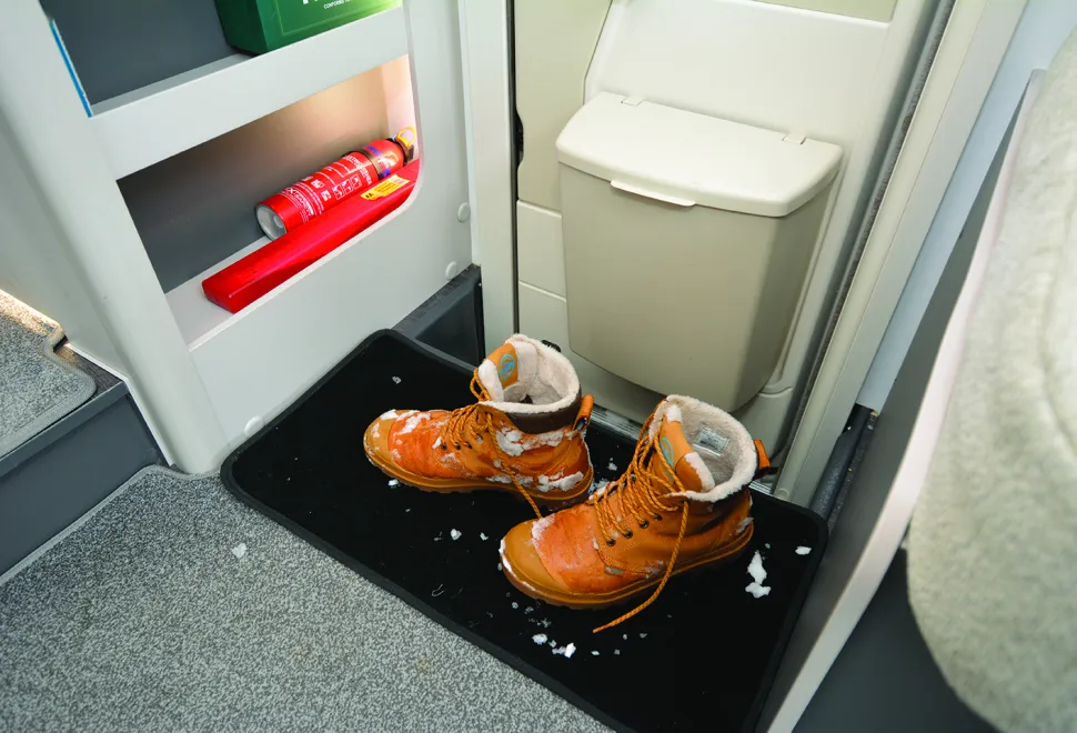 Bailey Alora 69-4S motorhome doorway with a pair of snow-covered boots