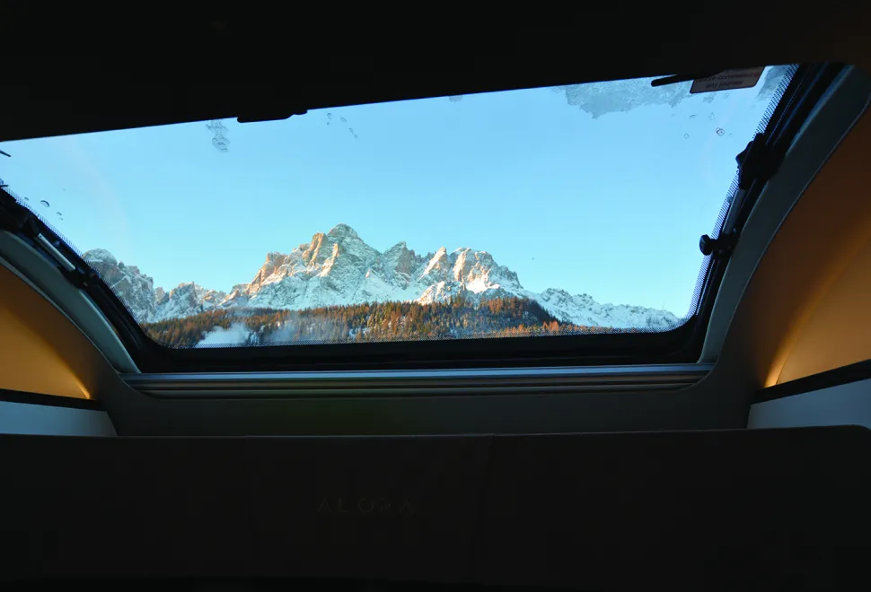 Bailey Alora 69-4S motorhome view of the Italian alps through the overcab skylight
