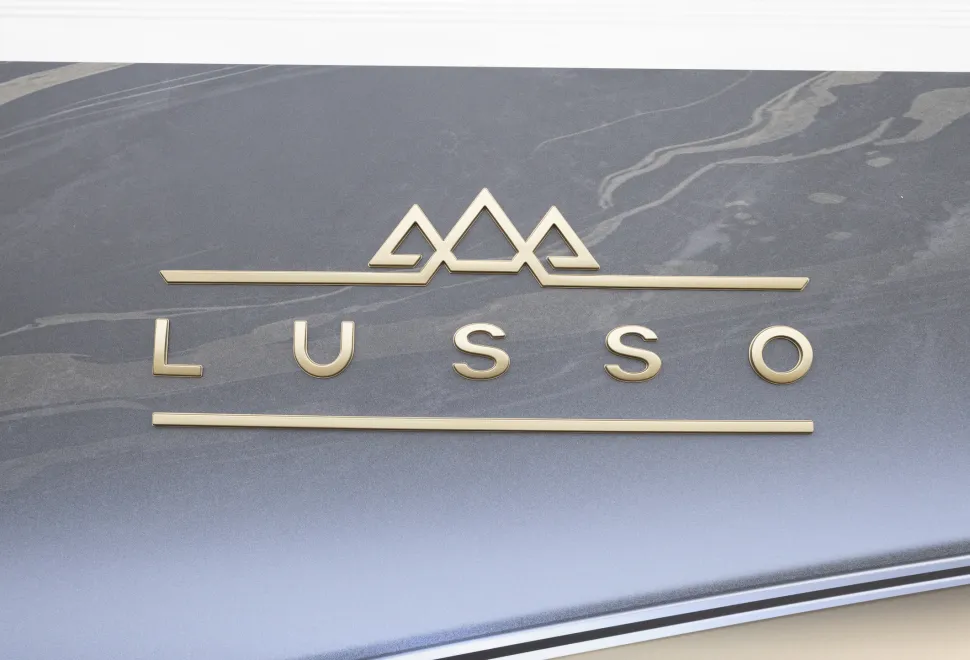 The exterior logo of the Coachman Lusso II