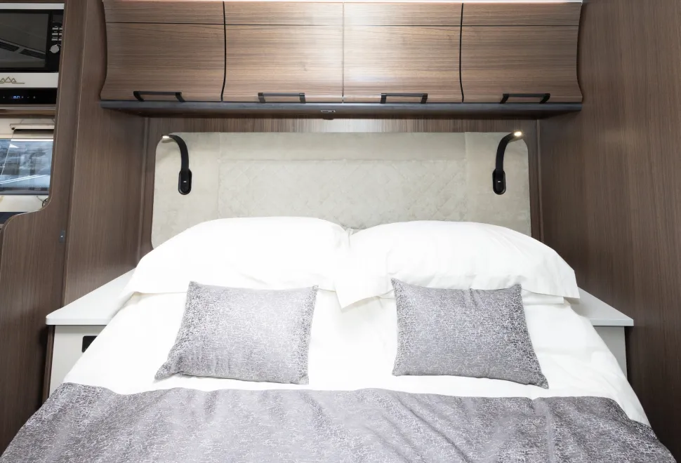 The over-bed lockers are a reverse-curve shape