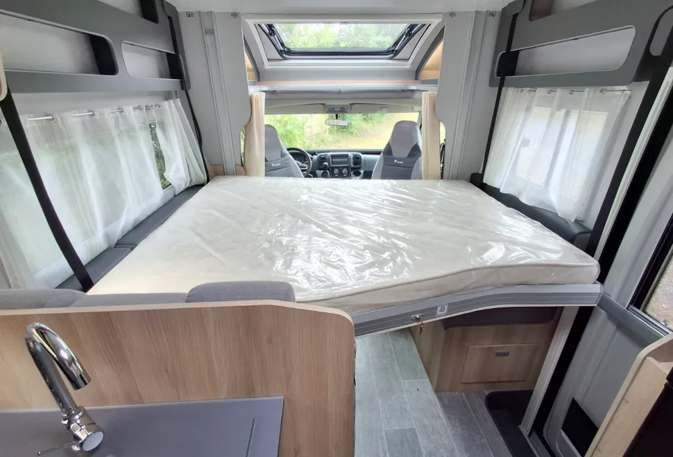 The drop-down bed inside the Itineo Cozi PS740
