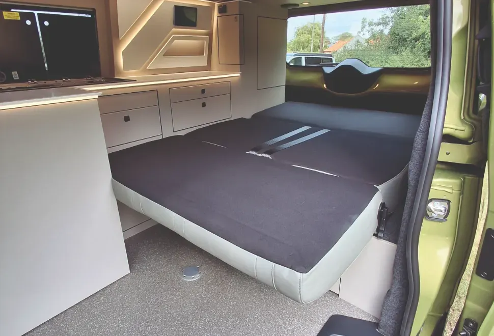 The bed inside the Hillside Birchover Classic T7 campervan