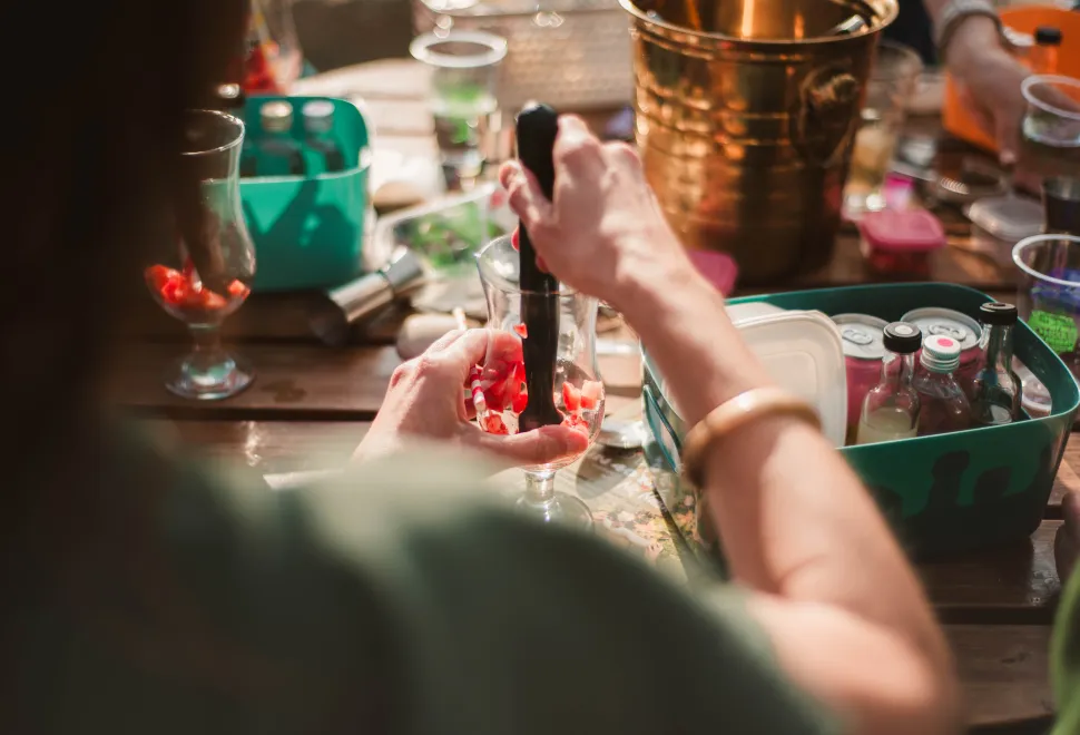 person making a cocktail
