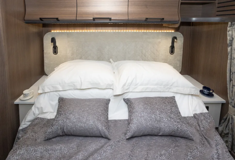 A row of LED bulbs outlines the top of the bedhead