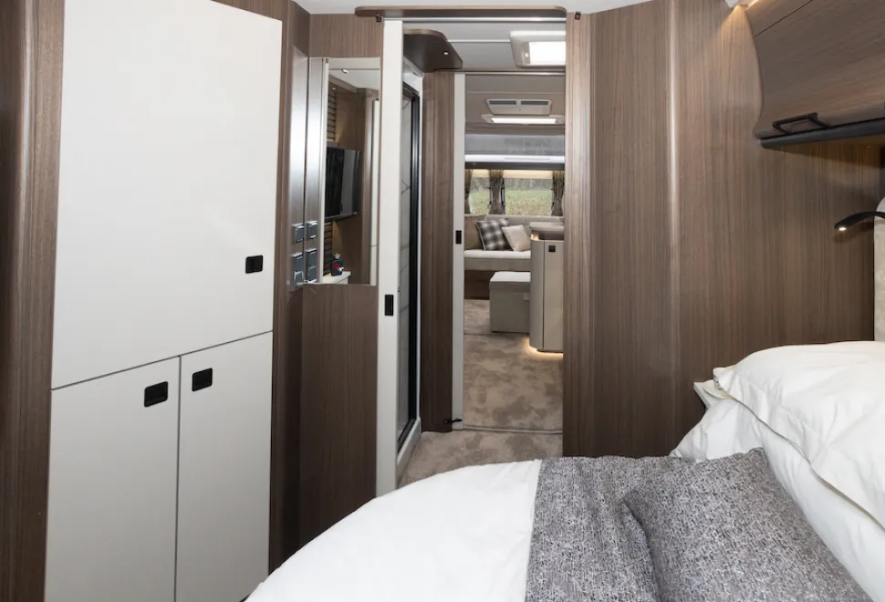The white sliding doors on both the front and rear of the shower room have magnetic catches.