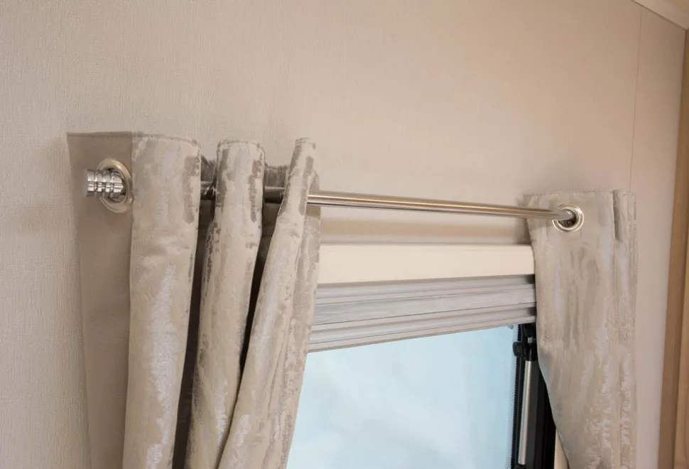 Eyelet-style-curtains-hang-on-bold-chrome-cafe-style-poles-84382