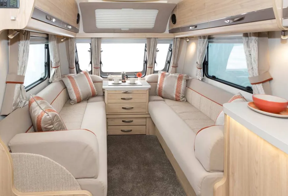 The-coppery-orange-shade-in-the-cushions-and-piping-detail-injects-warmth-to-the-look;-the-fabric-scheme-is-called-Sahara-77227