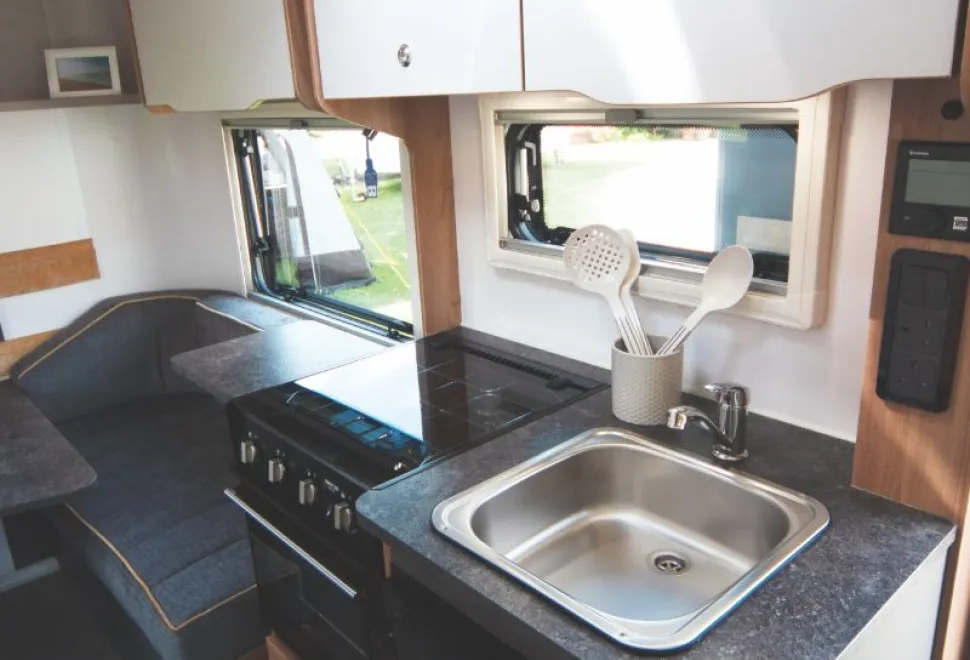 A-three-burner-hob,-combined-oven-grill-and-a-surface-extension-to-hinge-up-at-the-rear-16898