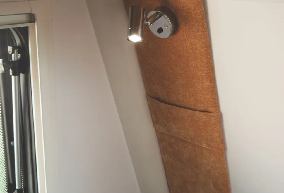 USB-ports-are-set-into-the-bases-of-the-spotlights-and-there-are-pockets-for-phones-on-the-walls-17414