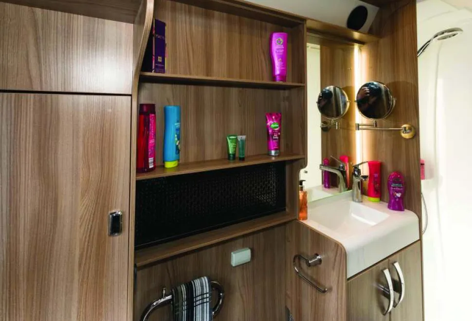 Speakers,-a-mirror-on-a-bracket-and-a-heated-towel-rail-in-the-washroom-80119