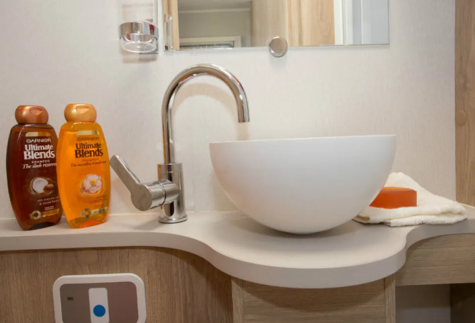 The-circular-washbasin-looks-so-high-end-domestic,-sitting-up-on-top-of-the-cabinet-w800-87705