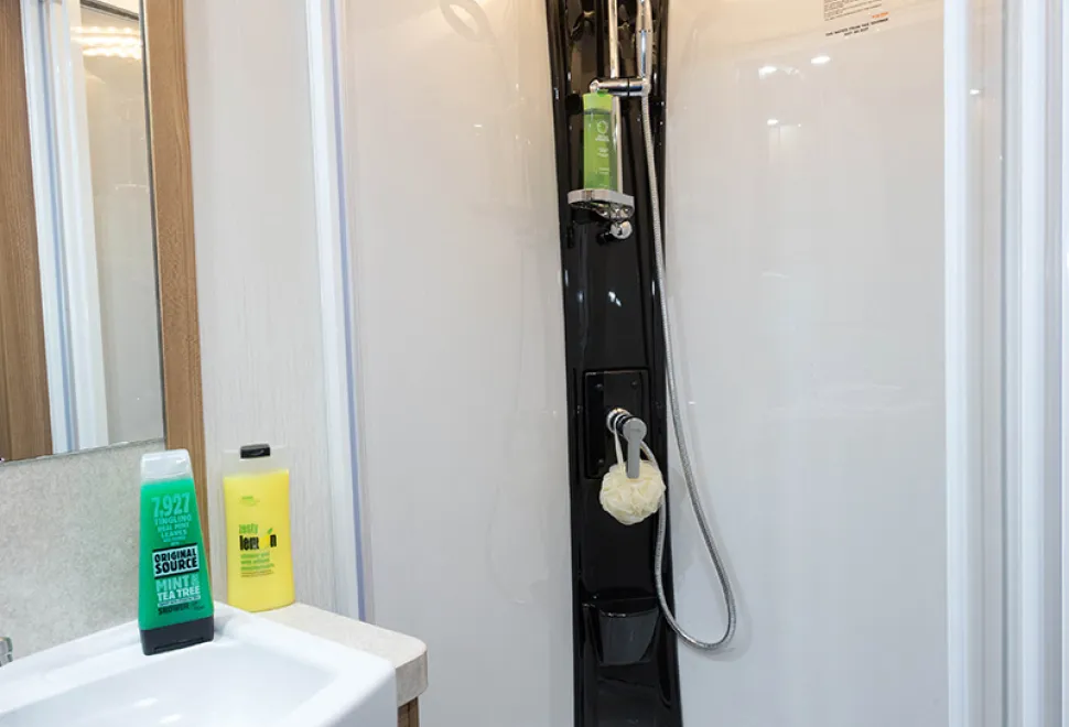 web-Bright-lights-crown-the-top-of-the-smart-black-shower-unit-67737