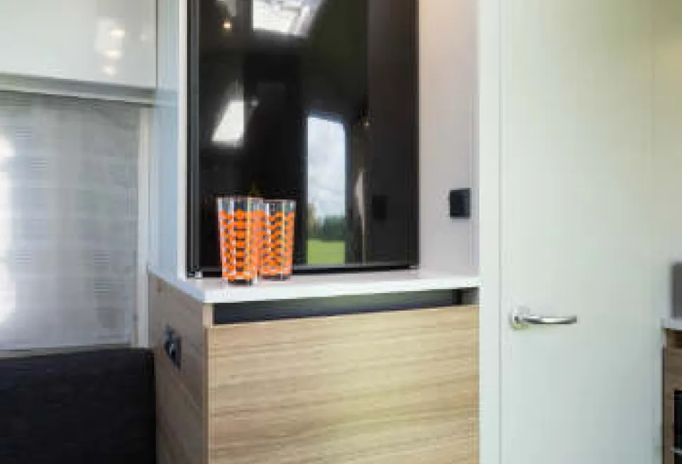 Alongside-the-fridge,-the-white-door-leads-to-a-Tardis-like-shower-room-w350-66690