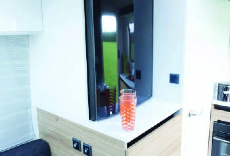 The-fridge-is-forward-of-the-kitchen-above-a-cabinet-of-drawers-w350-69815