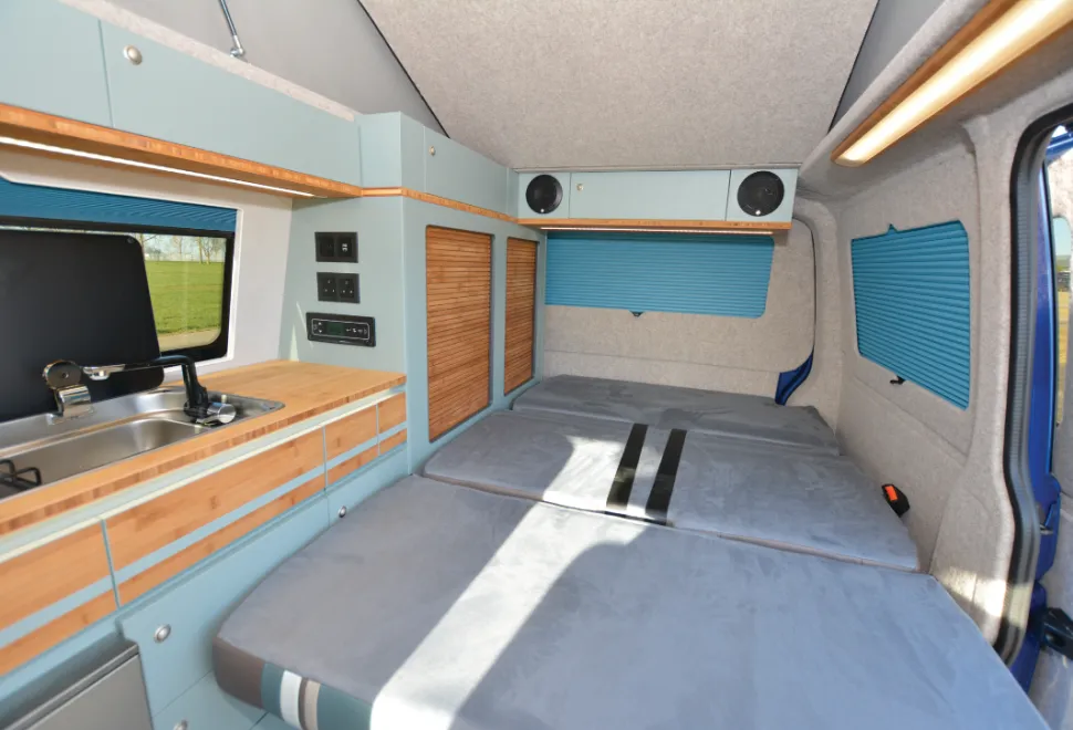 The Out and About Campers rising roof campervan bed