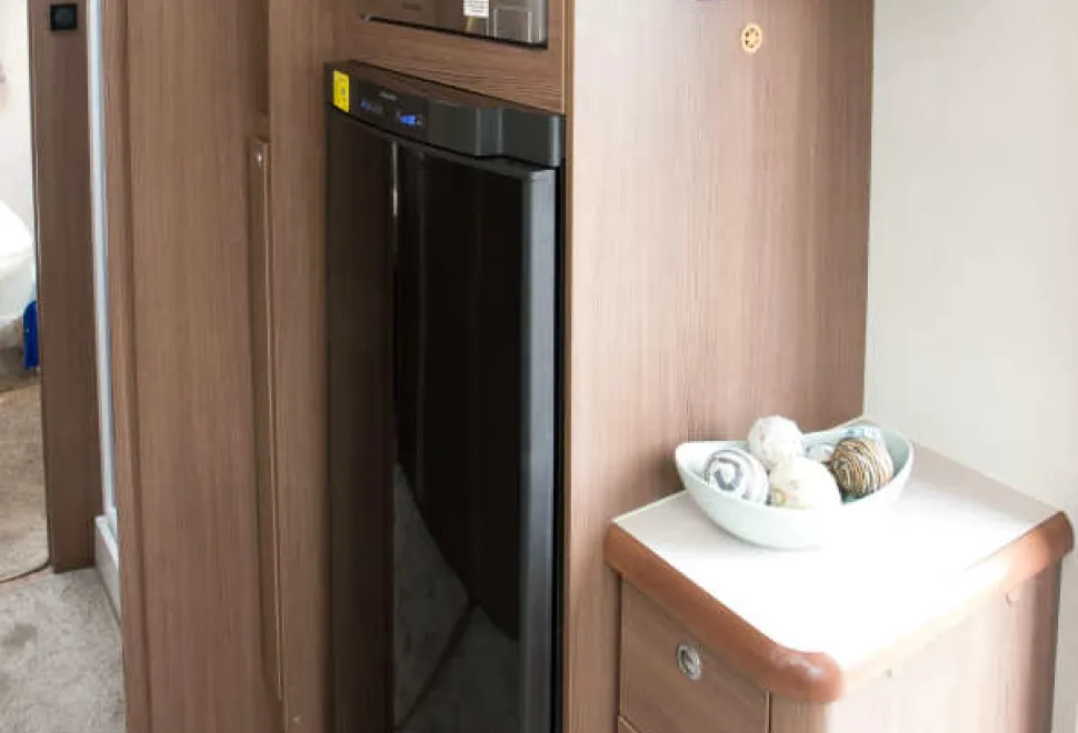 A-drinks-cabinet-alongside-the-tower-style-fridge--70313