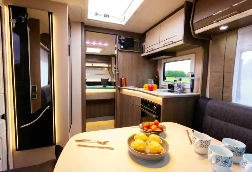 A-large-table,-good-sized-kitchen-and-a-cosy-bedroom-beyond-14082