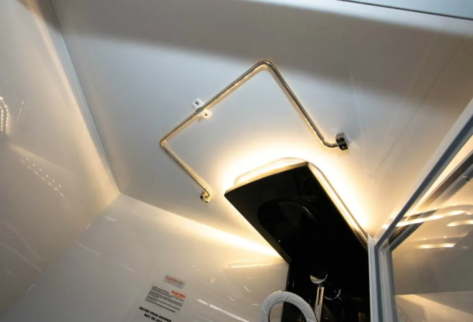 A-hinged-towel-rail-is-mounted-in-the-shower-cubicle-ceiling-27434