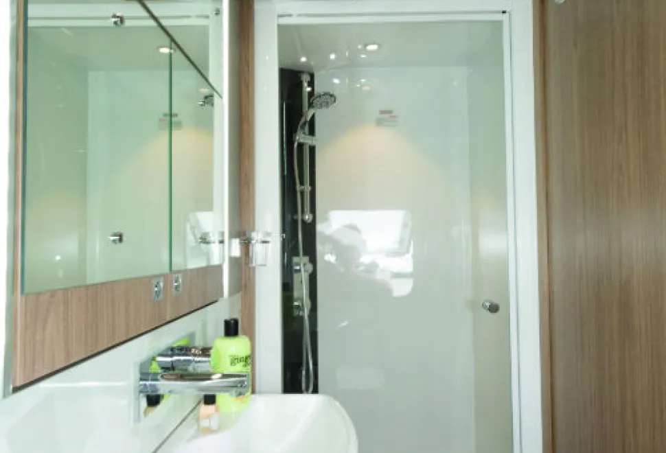 The-shower-cubicle,-a-good-sized-65cm-x-80cm,-contains-two-shelves-for-shampoo-containers-w500-85273