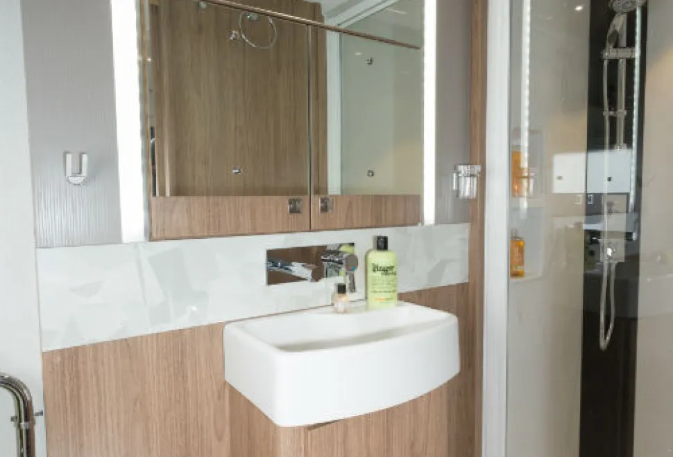 A-mirror-bordered-by-light-strips-in-the-centre-of-the-washroom-w500-83968
