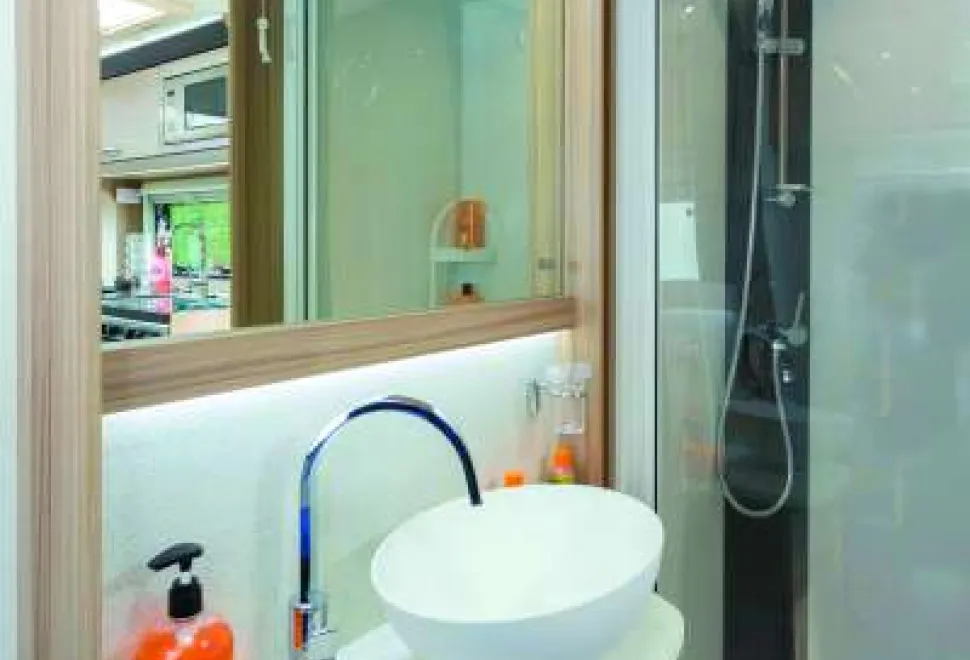 Lighting-runs-both-above-and-beneath-the-large-mirror-49083