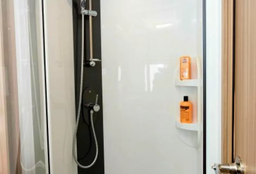 Two-good-sized-shelves-for-shampoos-are-in-the-shower-cubicle-48052