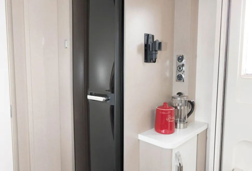 The-tall,-slim-fridge-with-removable-freezer-is-opposite-the-kitchen-58185
