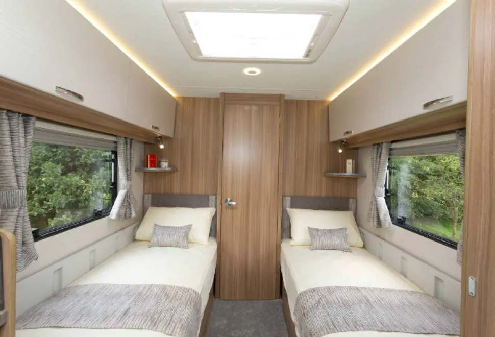 Bright-light-above-the-white-top-locker-doors-and-two-big-windows-enhance-the-spacious-look-of-the-bedroom-w800-34886