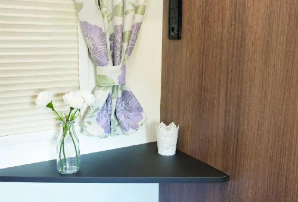 A-triangular-bedroom-table-for-your-television;-connection-points-are-above.-w500-39890
